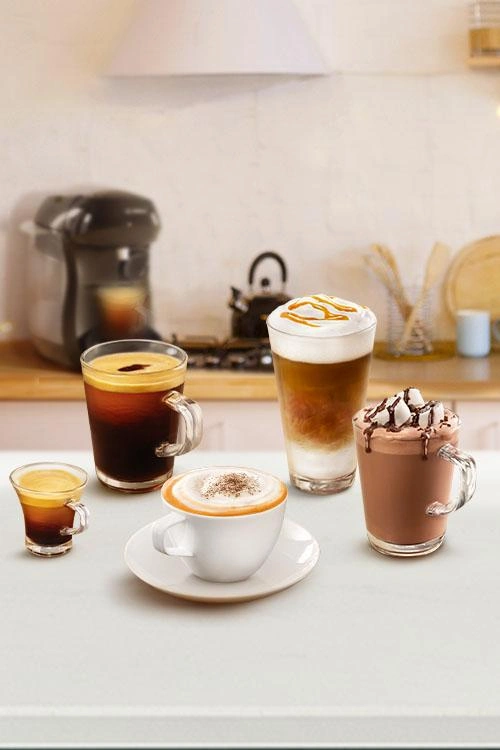 TASSIMO coffee drinks assortment on a kitchen counter.