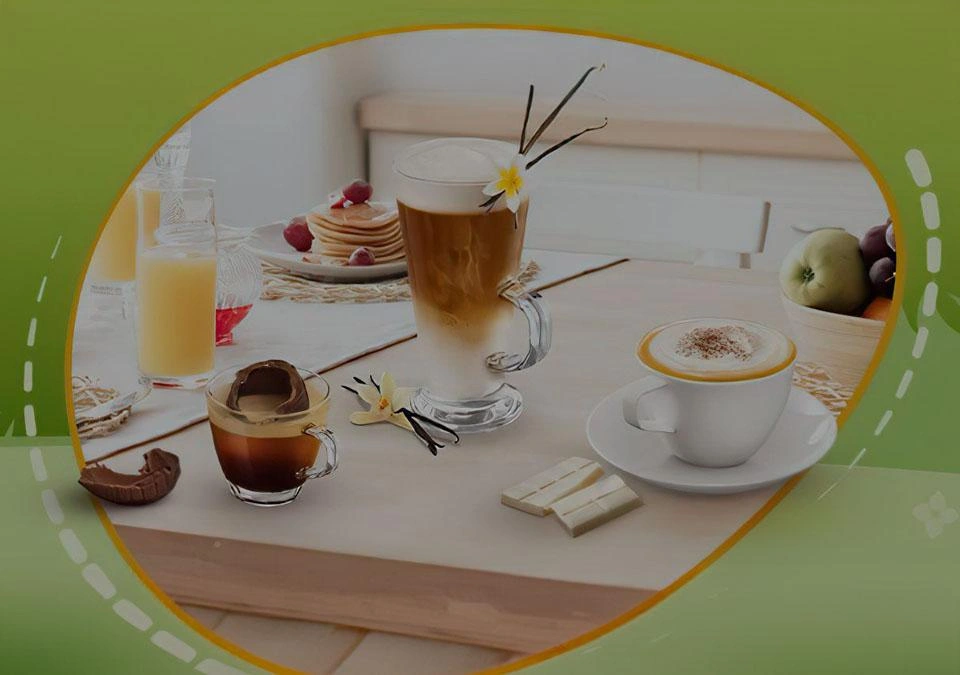 Enjoy a delightful breakfast in a cozy kitchen setting with an assortment of coffee drinks, including TASSIMO's rich brews, paired perfectly with fluffy pancakes and fresh fruit.