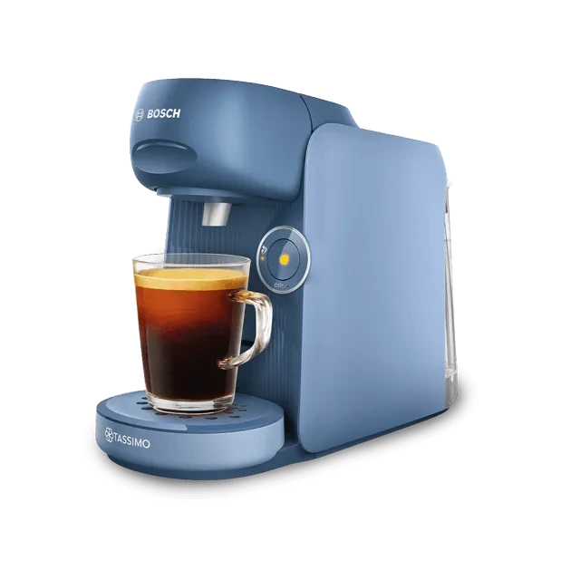 Show a Blue TASSIMO coffee machine with a glass cup poised perfectly under the spout, ready to catch the fresh brew.