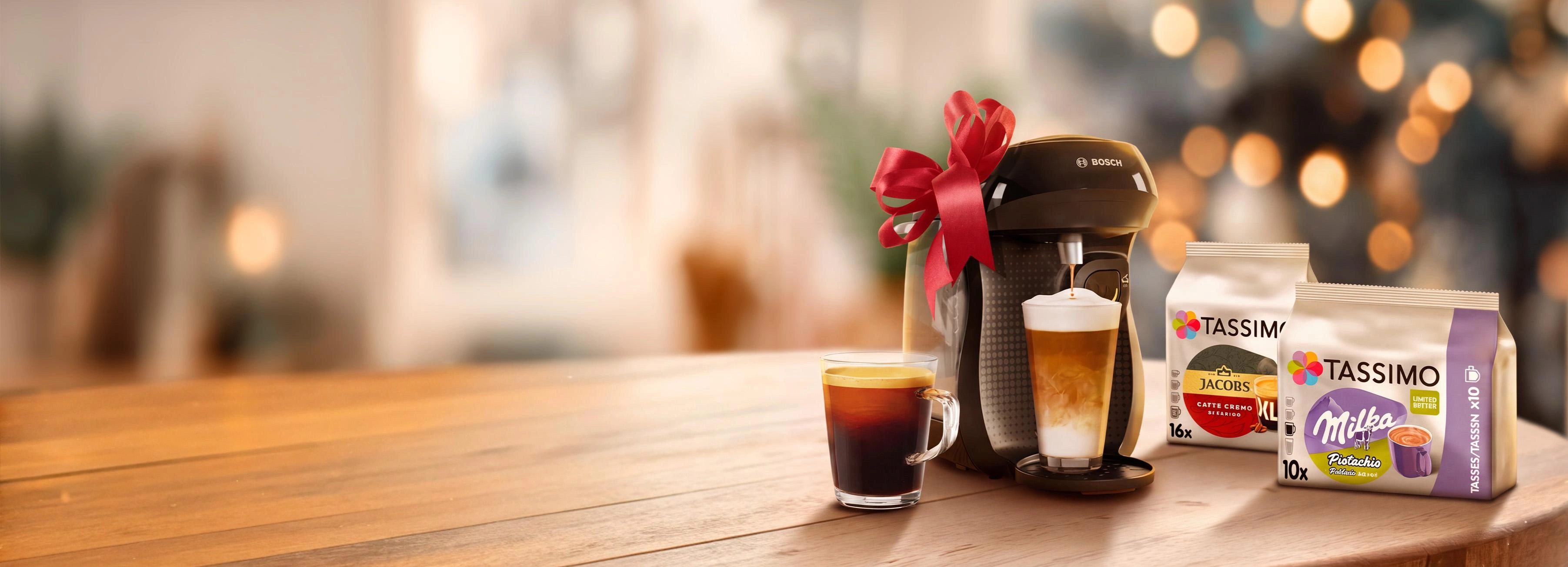 TASSIMO Kaffeemaschine mit Geschenkband und Kaffeekapseln
