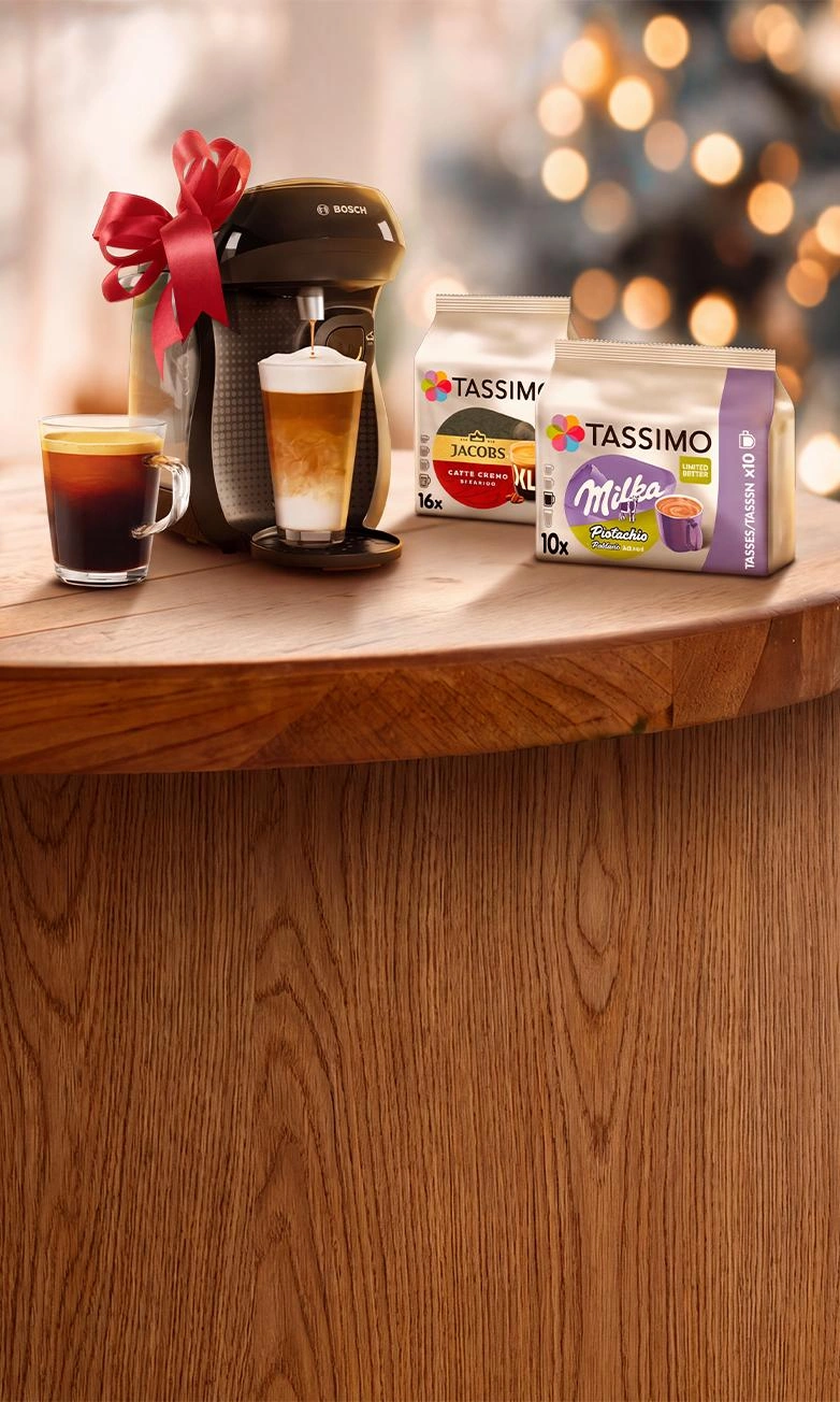 TASSIMO Kaffeemaschine mit Geschenkband und Kaffeekapseln