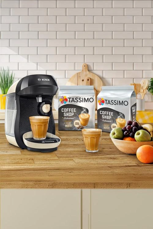 Equip your kitchen with a TASSIMO coffee machine, complete with latte options and Tassimo coffee packets. Finish the setup with a colorful fruit bowl on the counter for a vibrant touch.
