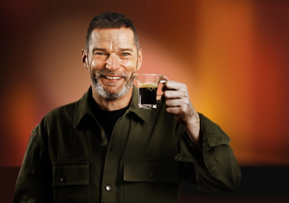 Fred Sirieix holding a cup of L'OR Espresso Coffee