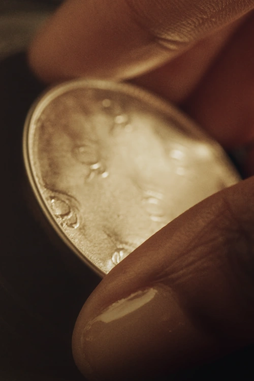 A hand carrying LOR Espresso Coffee Capsule