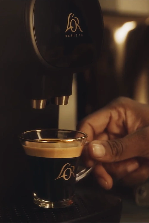 Espresso cup in a L'OR BARISTA coffee machine.