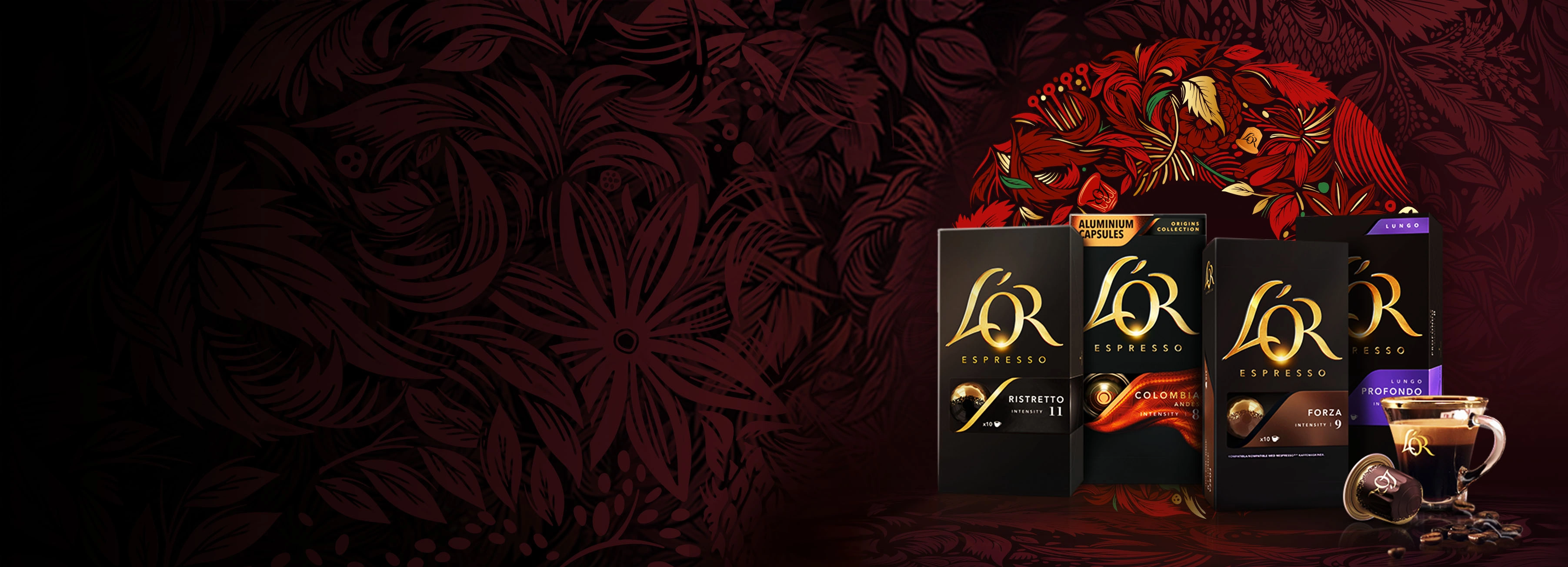 L'OR Ristretto, Colombia, Forza and Profondo packs with coffee cup, capsule and scattered beans on a red wreath background.