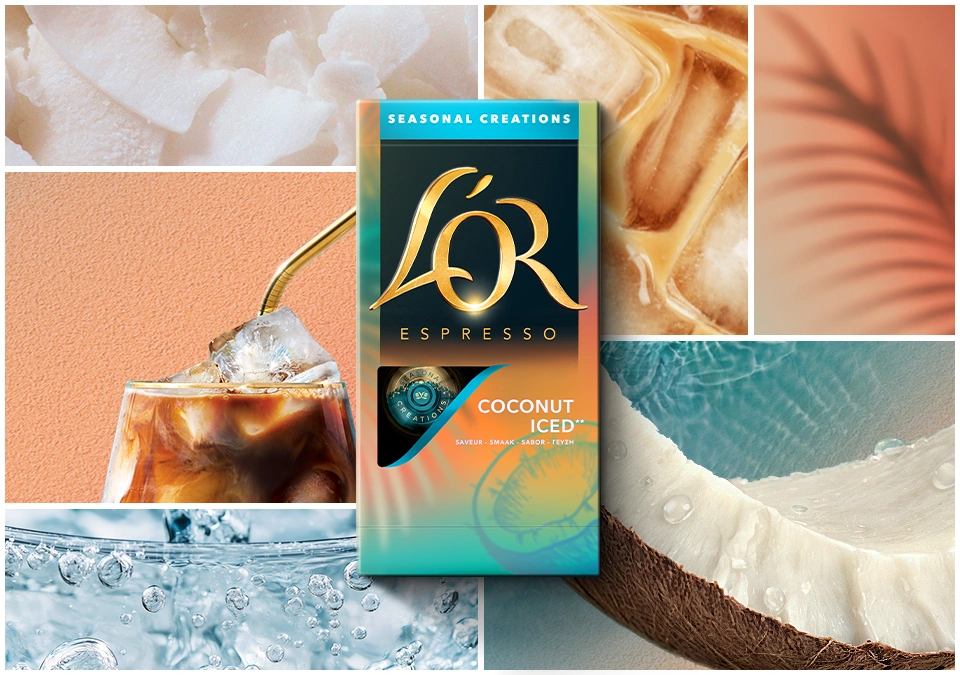 Iced coconut coffee served in a tall glass with L’OR Coconut capsules and tropical ingredients on a marble table