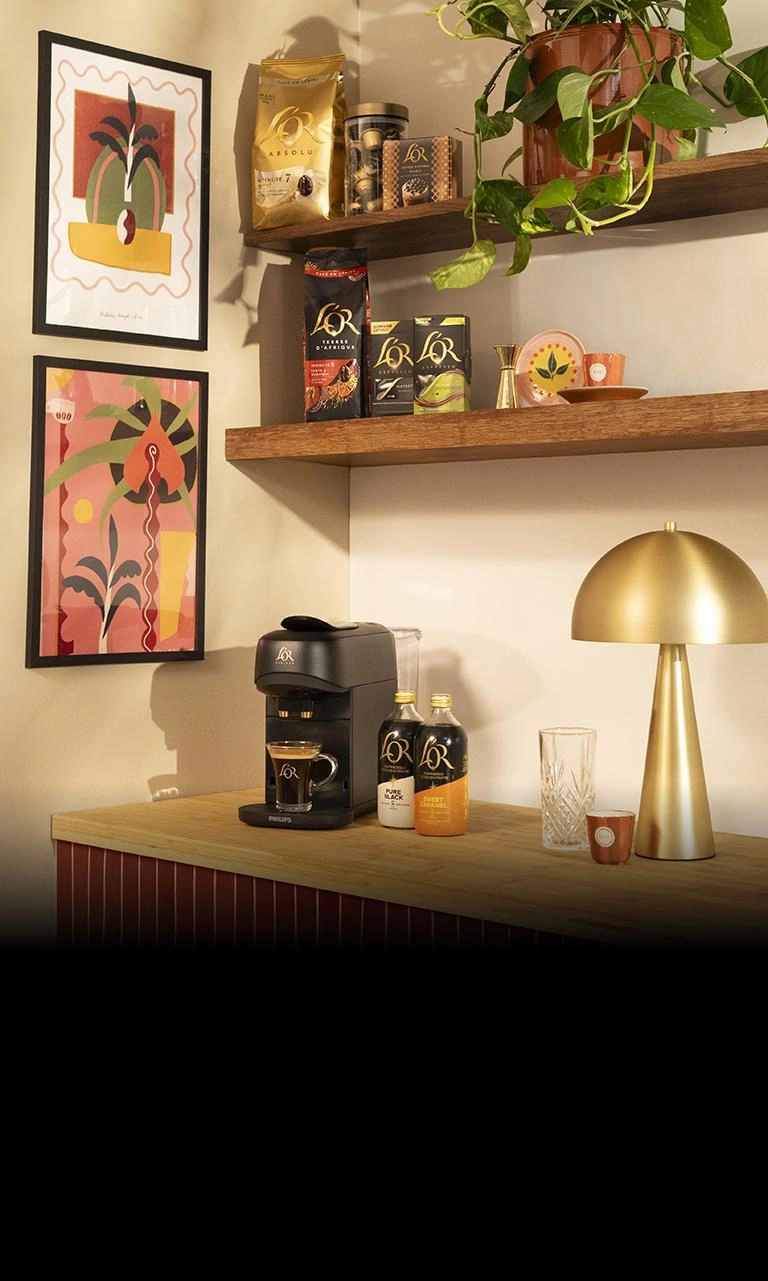 L'OR Espresso Coffee products on tables and shelves next to Laetitia Rouget's designs