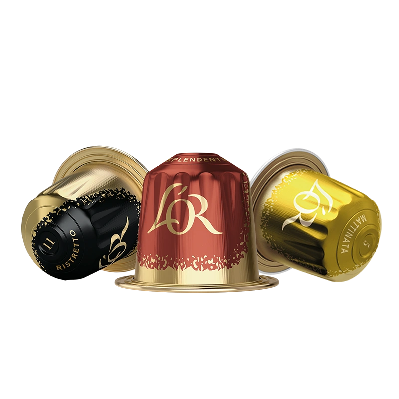 Black, red and yellow L'OR coffee capsules arranged together.