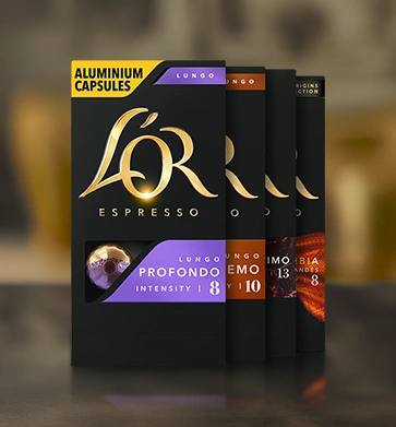 Four boxes of L'OR Barista coffee capsules in assorted blends.