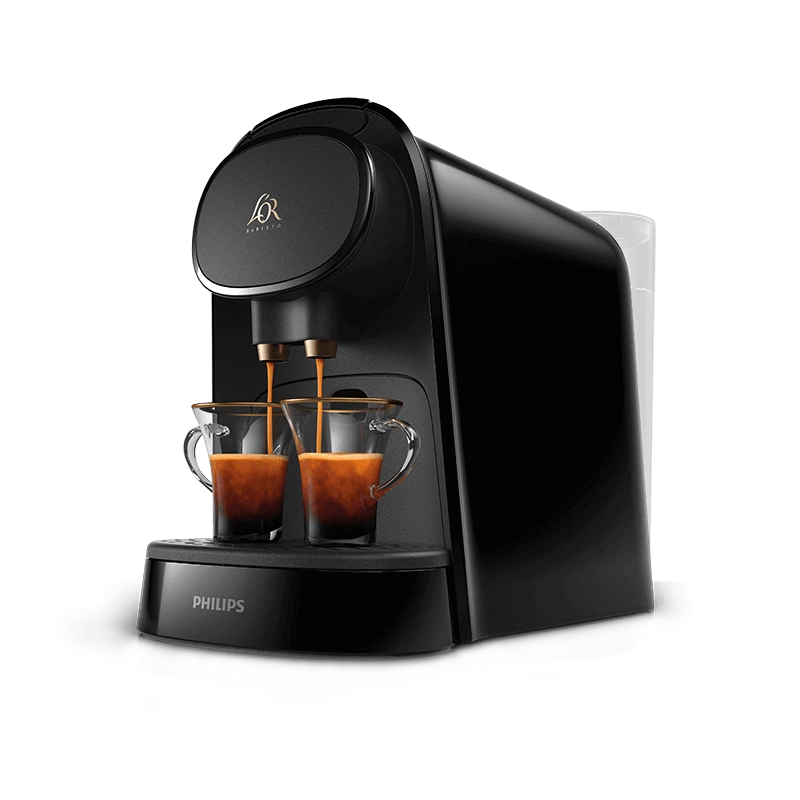Glossy black L’OR BARISTA coffee machine brewing two espressos simultaneously.