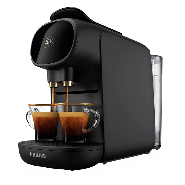 Black L’OR BARISTA machine preparing two espressos in matching glass cups.