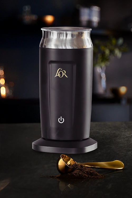L'OR Milk Frother on a dark counter.