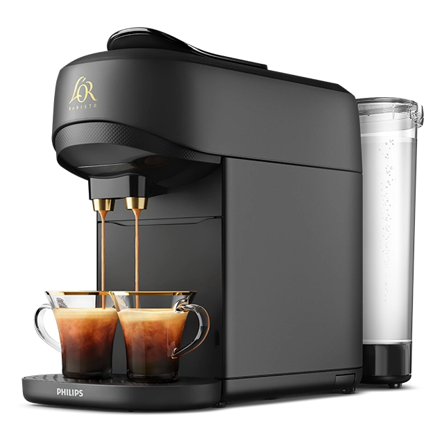 Black L’OR BARISTA Absolu machine with two espressos brewing, water tank visible at the back.
